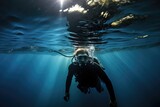 Diver's Reflection: Capturing the reflection of a diver in a calm underwater surface.