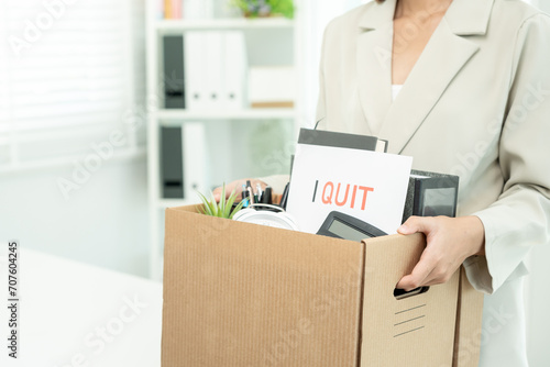 resignation, leave, quit, Stressful businesswomen will resign from the company. Female staff is lifting a brown paper box that holds personal items. , job placement and vacancies, resignation letter © Shisu_ka