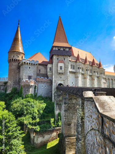 The famous Hunedoara Castle, Castelul Corvinilor or Corvin Castle with the Podul de Lemn castle bridge in summer with a blue sky, Hunedoara, Transylvania, Romania