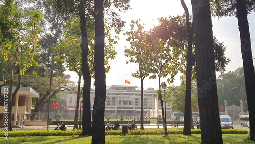 Timelapse Independence palace at Ho Chi Minh city view from park, white house of history, time lapse scene with vehicle moving on street front president hall, Saigon Vietnam photo