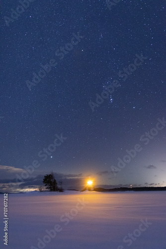 winter time starry sky over the lighthouse