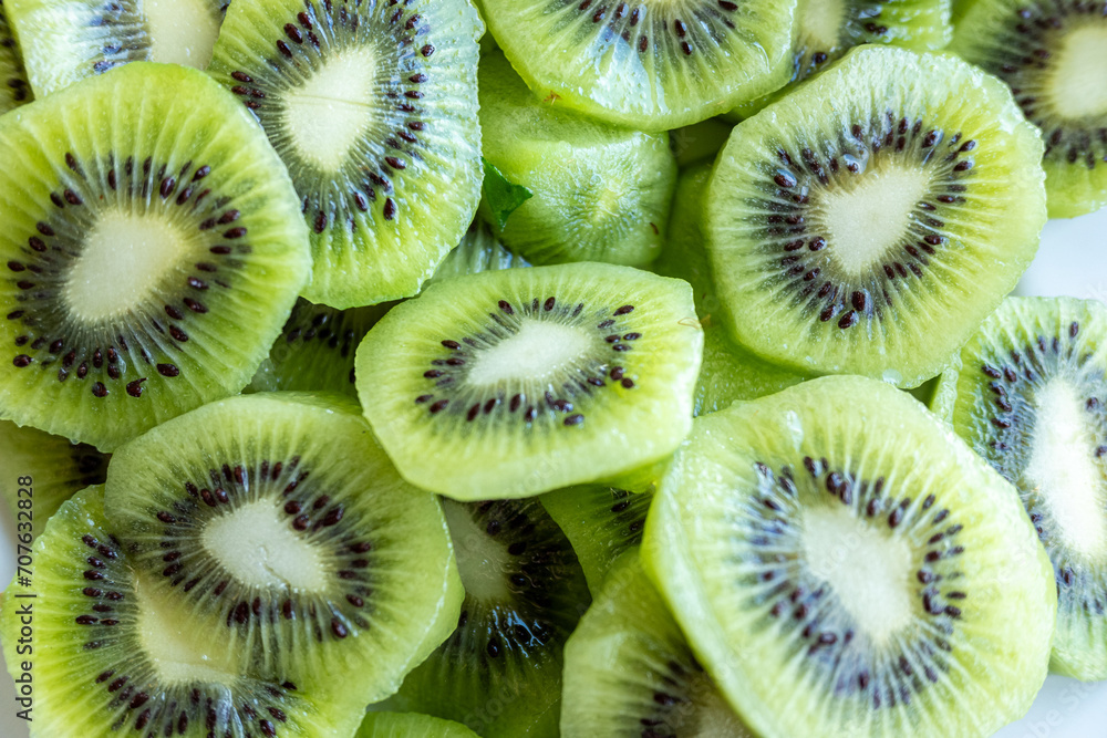 background of freshly cut organic kiwifruit slices, health food concept background of freshly cut organic kiwifruit slices, health food concept