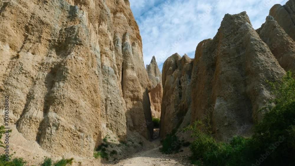 Natural wonder: Gap in stunning clay cliffs. Mesmerizing stock footage capturing the unique beauty of geological formations Natural wonder: Gap in stunning clay cliffs. Mesmerizing stock footage capturing the unique beauty of geological formations