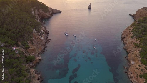 Ibiza beach Sunset colorful benirras bay Island. Perfect aerial top view flight tilt down drone
High quality 4k footage photo