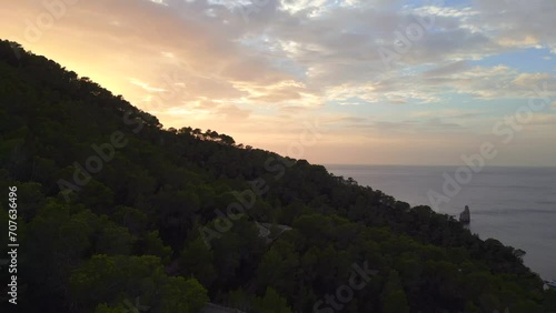 Ibiza Mountain road Sunset colorful benirras bay Island. Gorgeous aerial top view flight ascending drone
High quality 4k footage photo