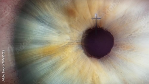 Cross of calvary in the center of human eye macro  photo