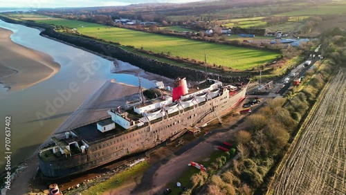 Ghost Ship the Duke of Lancaster at sunset - drone anti-clockwise rotate and pull back, reveal bay - Mostyn, North Wales, UK photo