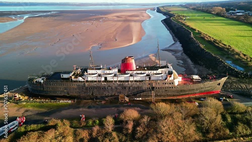 Ghost Ship the Duke of Lancaster at sunset - drone anti-clockwise rotate, bay backdrop - Mostyn, North Wales, UK photo