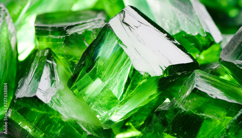 Close-up View of a Glistening Emerald Crystal against a Dark Black Background