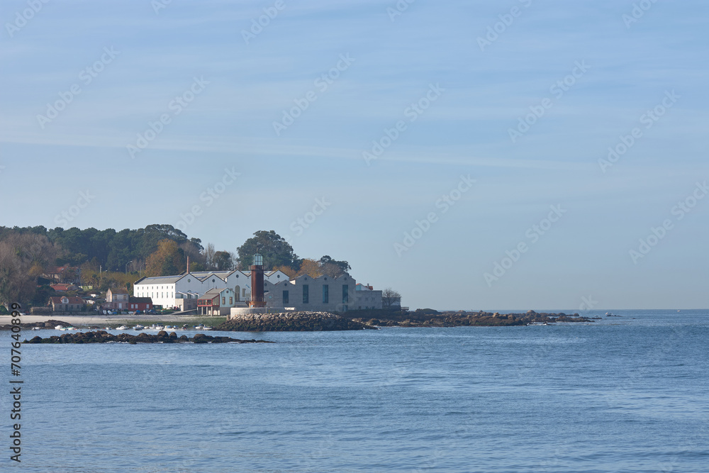 Fototapeta premium The Sea Museum in Vigo has a long pier where they have rebuilt the old lighthouse