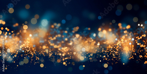 Blue and gold Abstract background with fireworks and bokeh, graphic resources. stars and circles in gold color in bokeh effect.Glitter luxury gold. The background for the holiday.