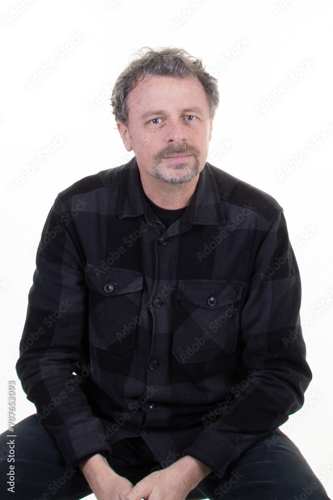 Portrait middle aged man with gray hair face of handsome middle-aged guy smiling at camera on white background in dark plaid shirt black grey Portrait middle aged man with gray hair face of handsome middle-aged guy smiling at camera on white background in dark plaid shirt black grey