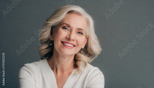 Beautiful gorgeous 50s mid age beautiful elderly senior model woman with grey hair laughing