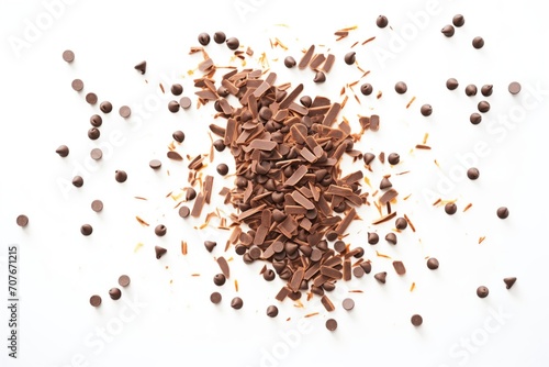 glossy chocolate chips scattered on white background