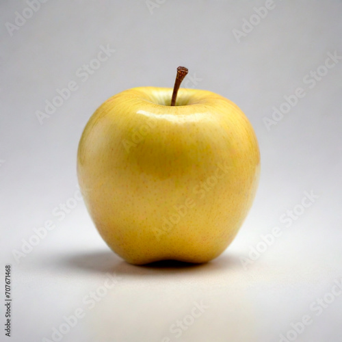 photorealistic image of a yellow apple on a white background