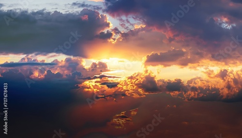 Great dramatic view. Clouds illuminated by the setting sun photo