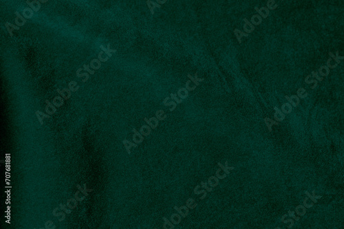 Dark green velvet fabric texture used as background. Emerald color panne fabric background of soft and smooth textile material. crushed velvet .luxury emerald tone for silk... photo