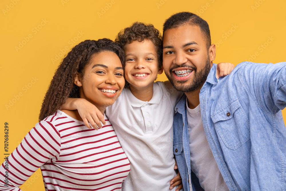 Cheerful Young African American Parents And Little Son Taking Selfie Together Cheerful Young African American Parents And Little Son Taking Selfie Together