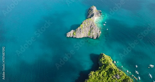 Twin Rocks in Miniloc Island. Boats over the sea. El Nido, Philippines. Palawan. photo