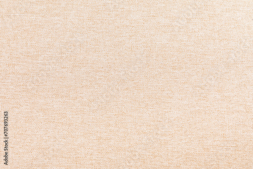 Blank warm fabric background surface. Beige Fabric wallpaper. Space for text. Backdrop. Studio photography. Cozy and Comfortable. Decorative. Minimalist wallpaper. Empty space.