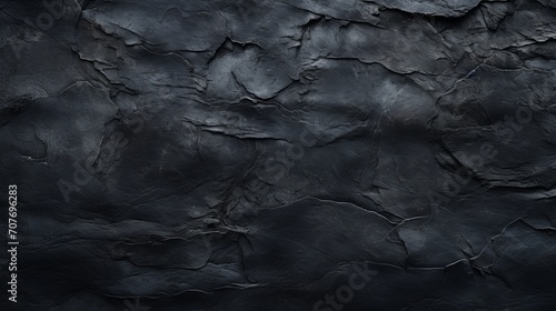 Black concrete wall with paintbrush strokes and cracks for a spooky and creepy background. Suitable for horror and halloween themes