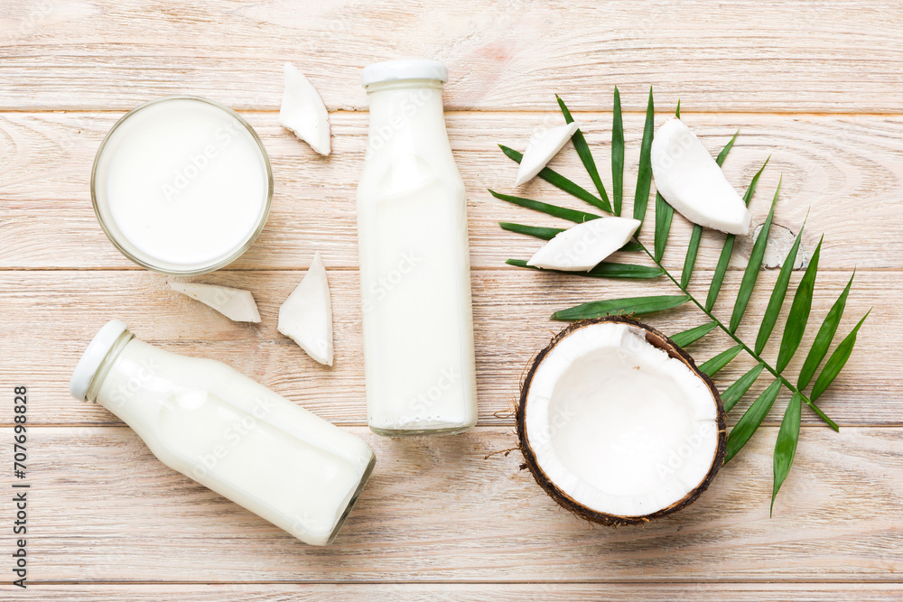 coconut products on white wooden table background. Dairy free milk substitute drink, Flat lay healthy eating coconut products on white wooden table background. Dairy free milk substitute drink, Flat lay healthy eating