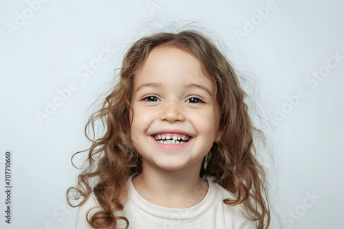 Laughing and smiling Kid girl close up portrait isolated on white background 