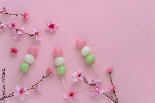 三色団子と桜の花　ピンク色の背景 photo