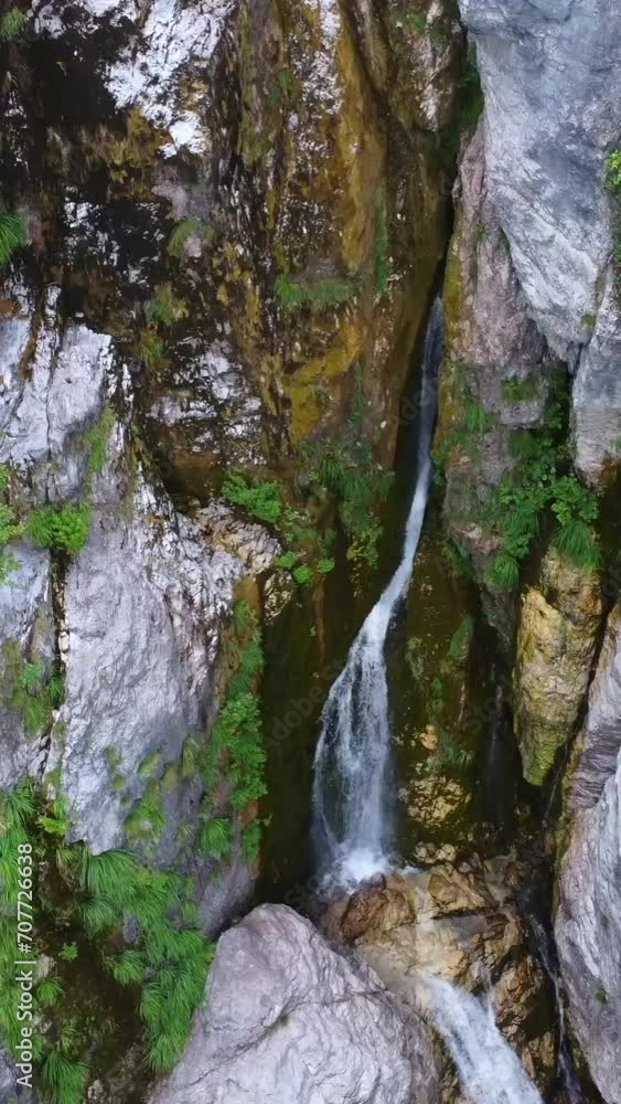 Aerial drone view of the waterfall in Theth National Park, Albania. Nacerero of the river in the rock Aerial drone view of the waterfall in Theth National Park, Albania. Nacerero of the river in the rock