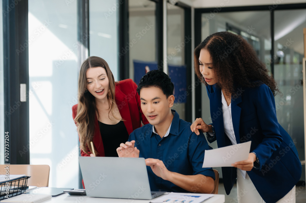 Office colleagues have a casual discussion. During a meeting in a conference room, a group of business teem sit in the conference room Office colleagues have a casual discussion. During a meeting in a conference room, a group of business teem sit in the conference room