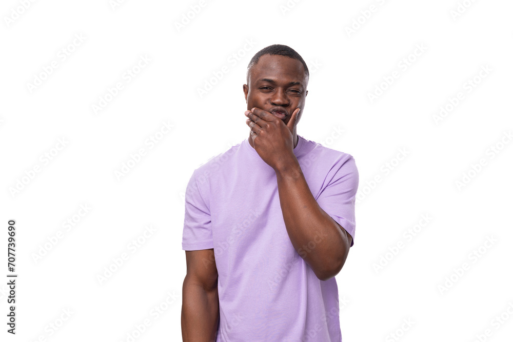 young surprised american guy dressed in a cotton t-shirt on a white background with copy space young surprised american guy dressed in a cotton t-shirt on a white background with copy space