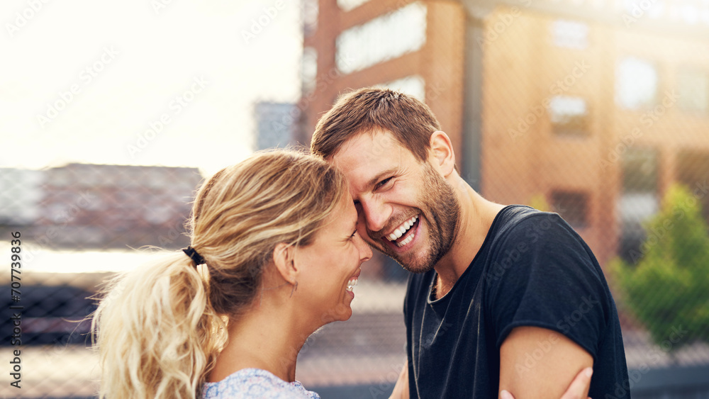 Happy spontaneous couple share a good joke Happy spontaneous couple share a good joke