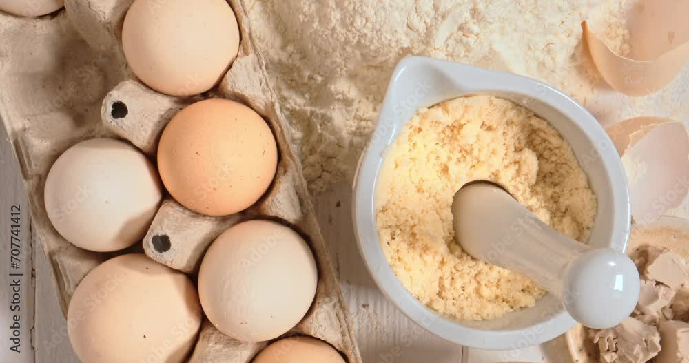 Preparing dough with flour, eggs and butter. Flat lay. Preparing dough with flour, eggs and butter. Flat lay.