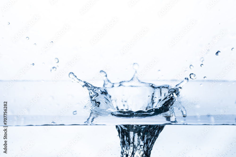 Vibrant splash of water with bubbles as fruit drops into pristine water on a white background. Ideal for banners promoting freshness and purity. Vibrant splash of water with bubbles as fruit drops into pristine water on a white background. Ideal for banners promoting freshness and purity.