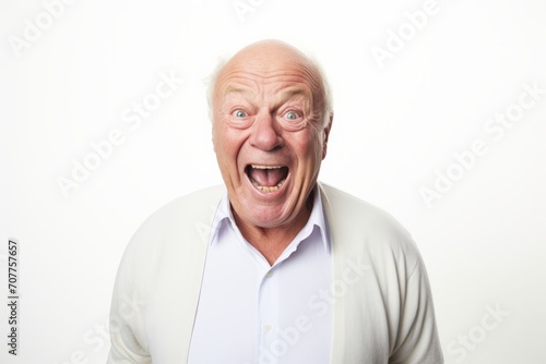 Surprised senior man looking at camera. Isolated on white background.