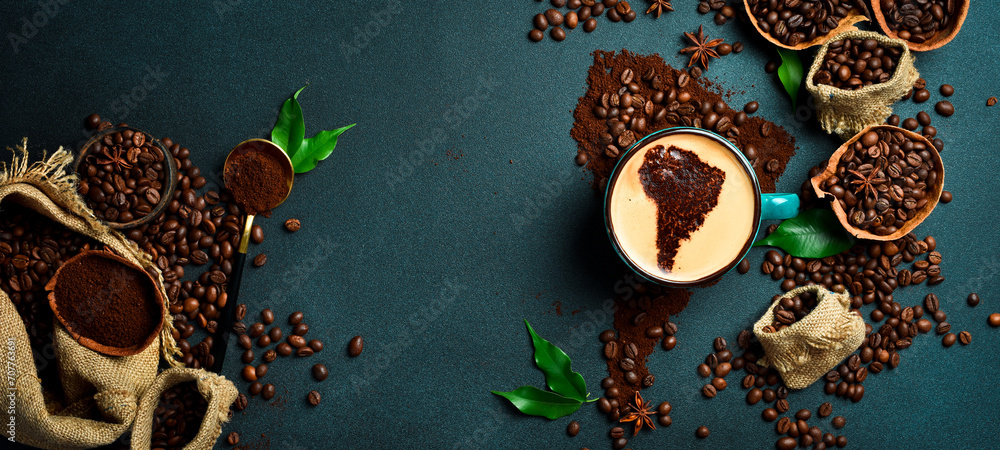 Obraz na płótnie A cup of aromatic fragrant coffee with an image of South America. Set of coffee beans and ground coffee in the shape of a world map w salonie