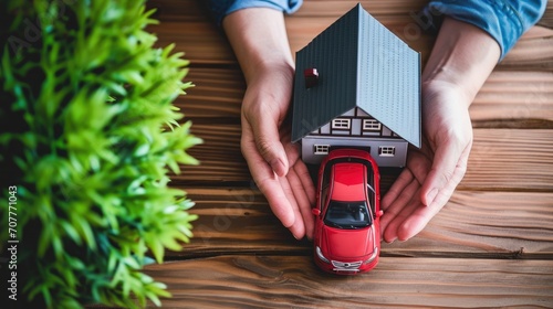 Hands holding car and house. Home loan, car insurance, family life assurance protection, financial mortgage for house building, and legacy planning investment concept with children photo