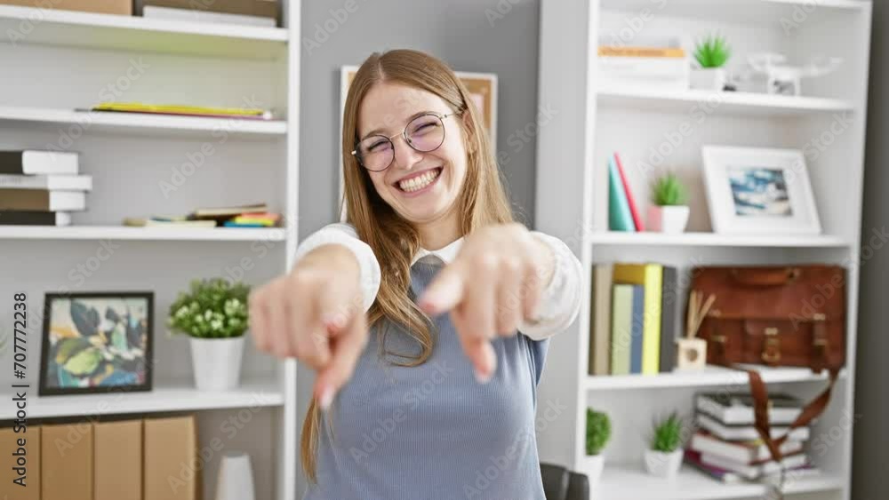 Happy successful young blonde businesswoman in the office, thumbs up sign, positive winner gesture Happy successful young blonde businesswoman in the office, thumbs up sign, positive winner gesture