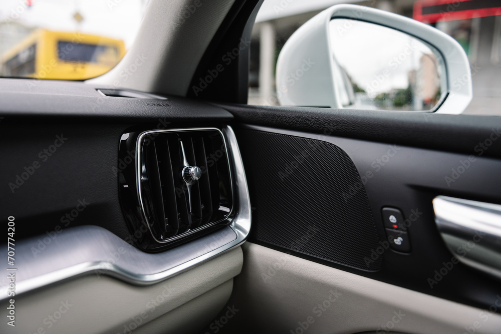 Deflector. Detail interior. Car ventilation system. Car air conditioner closeup. Air ducts. Automotive climate control. Airflow inside the car. Interior element of a modern premium car.