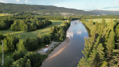 RV Campers Wild Camping at River in Heddal, Vestfold og Telemark, Norway - Aerial 4k Circling photo