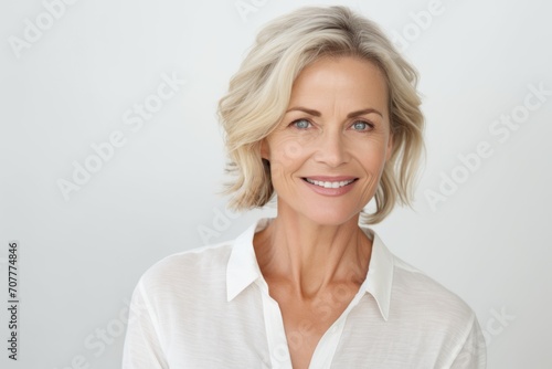 Portrait of beautiful mature businesswoman smiling and looking at camera.