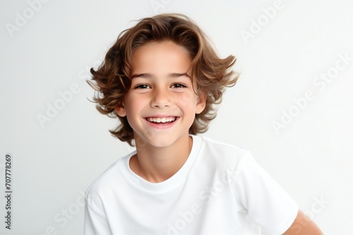 a professional portrait studio photo of a cute european boy child model with perfect clean teeth laughing and smiling. isolated on white background. for ads and web design