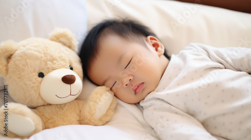 Newborn Asian baby boy sleeping with a teddy bear. Generative AI.