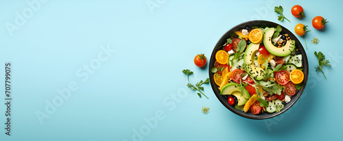 Top view on vegan salad from green leaves mix and vegetables on blue background generated AI