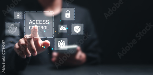 Access control concept. Businessman using mobile smartphone with virtual access control icon for access security personal data. Automatic access control system photo