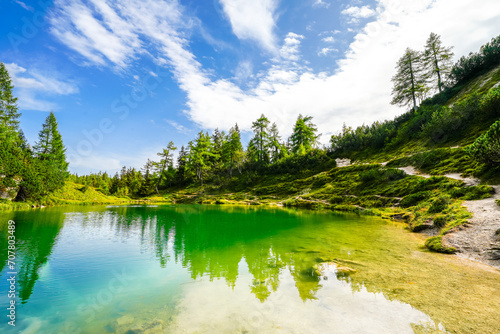 Fairy tale lake on the high plateau of the Tauplitzalm. View of the lake at the Totes Gebirge in Styria. Idyllic landscape with mountains and a lake on the Tauplitz.
 photo