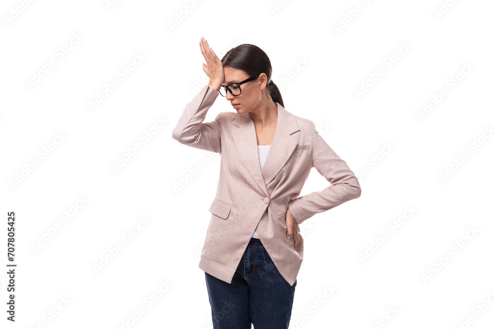 young perplexed slender european brunette woman stands thoughtfully on a white background young perplexed slender european brunette woman stands thoughtfully on a white background