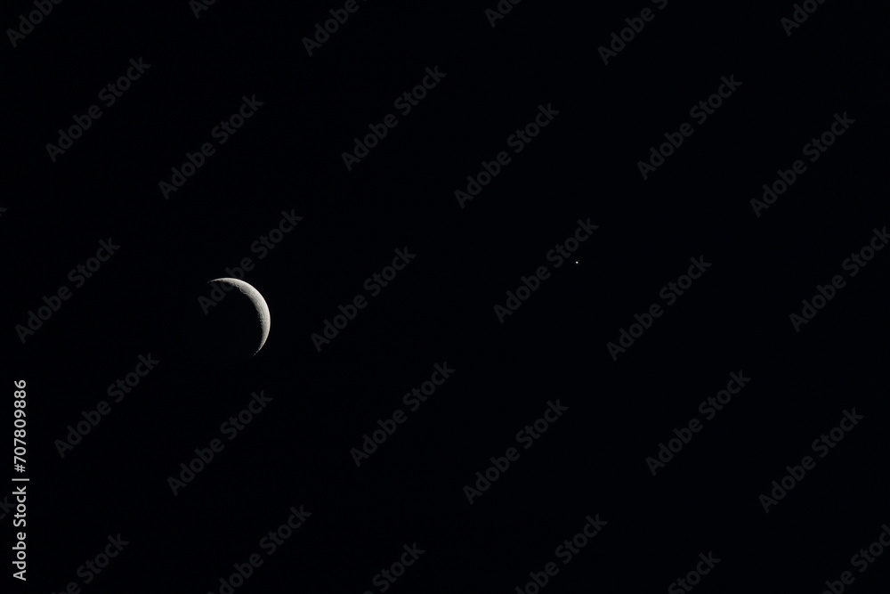 Waxing Crescent Moon. Moonlight In Night Sky. Bright Crescent Moon On Dark Black Night Sky. Amazing Night Sky Landscape And Moon, Stars. Real Sky With Star And Crescent. Copy Space. Waxing Crescent Moon. Moonlight In Night Sky. Bright Crescent Moon On Dark Black Night Sky. Amazing Night Sky Landscape And Moon, Stars. Real Sky With Star And Crescent. Copy Space.
