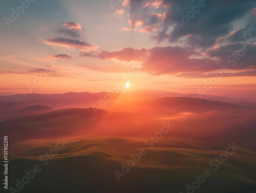 Sunrise over the horizon of the mountains aerial view cinematic photo. High-resolution © fillmana