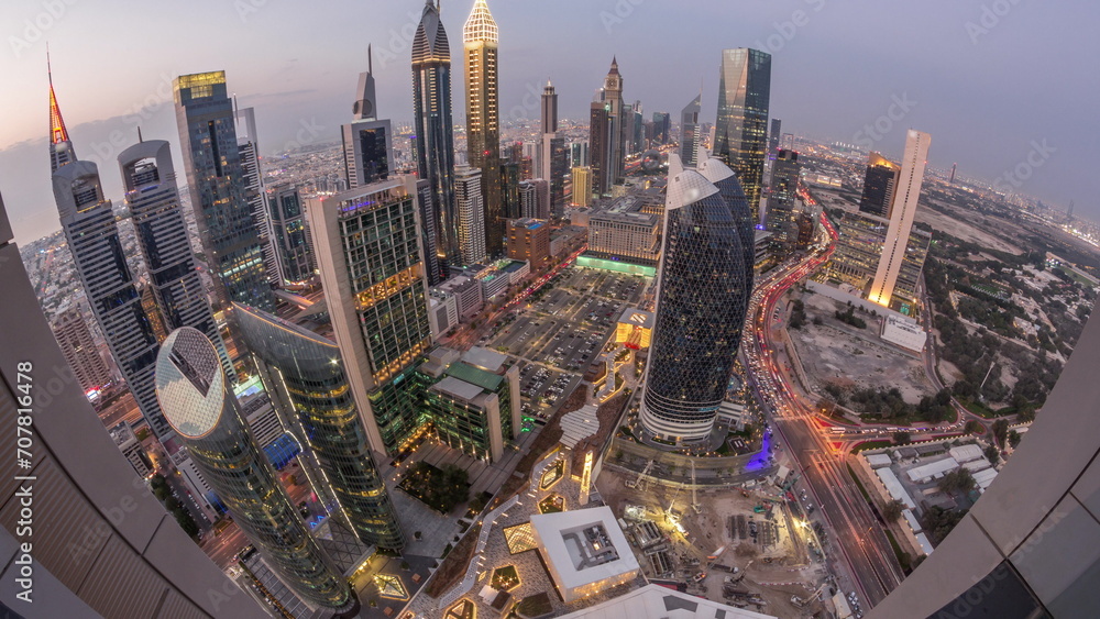 Φωτογραφία Skyline panorama of the high-rise buildings on Sheikh Zayed Road in Dubai aerial day to night timelapse, UAE